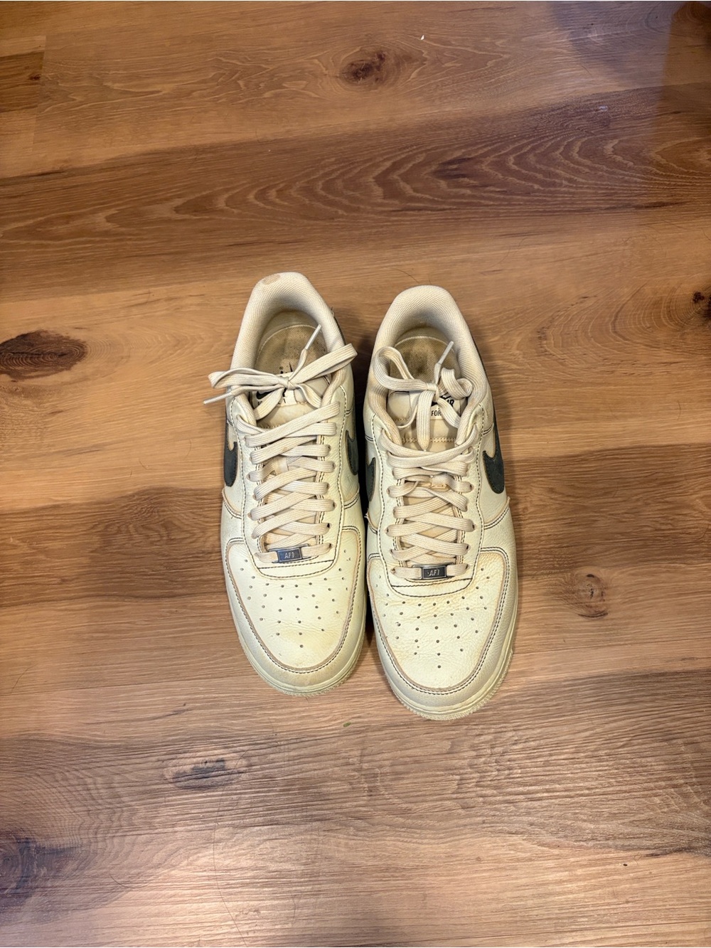 Nike Low-Top Sneakers — Cream with Black Swoosh